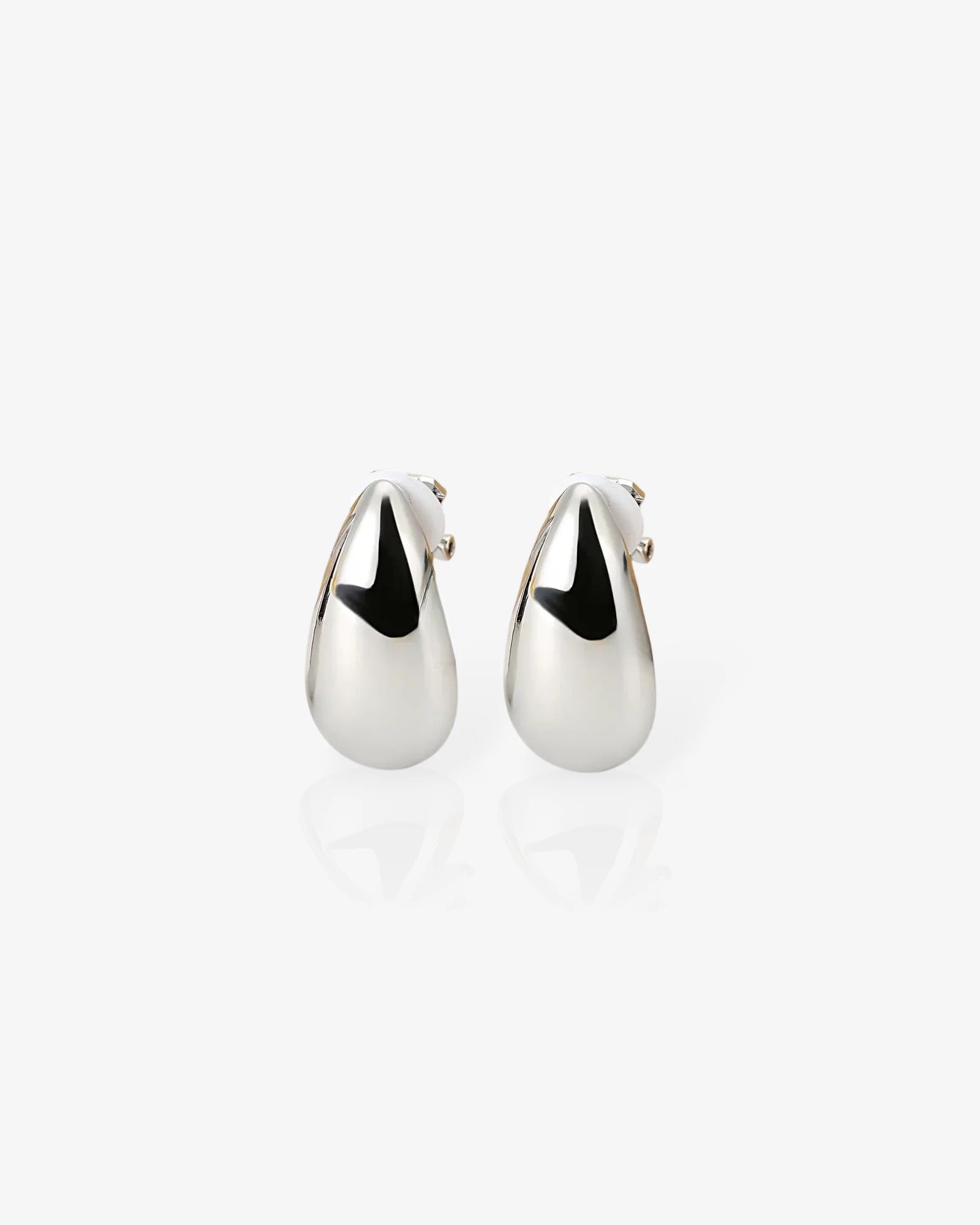 Pair of silver teardrop earrings on a white background