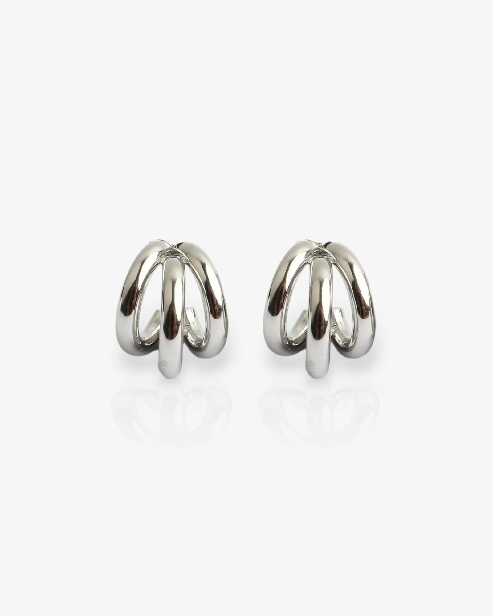 Pair of silver hoop earrings on a white background