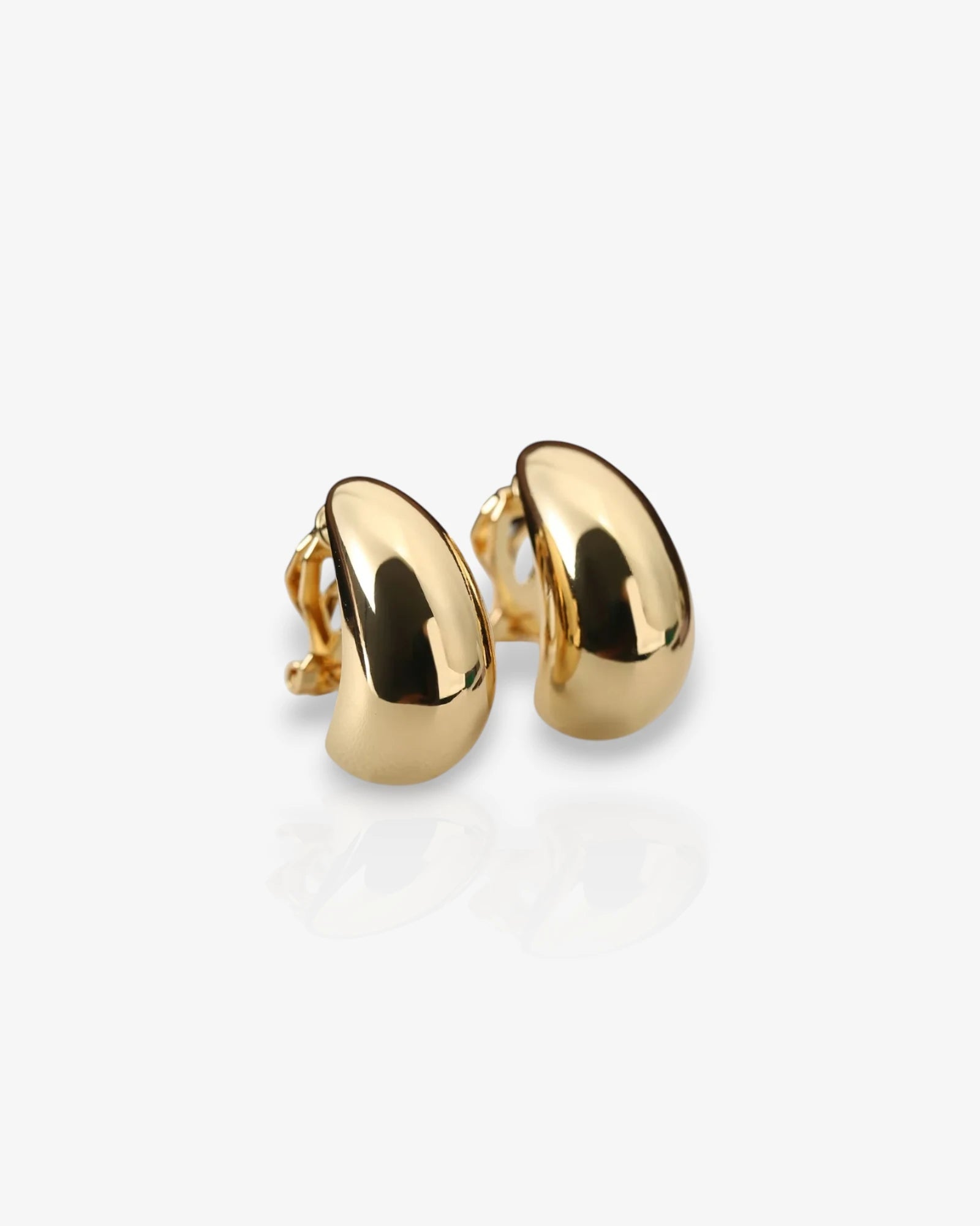 Gold hoop earrings on a white background