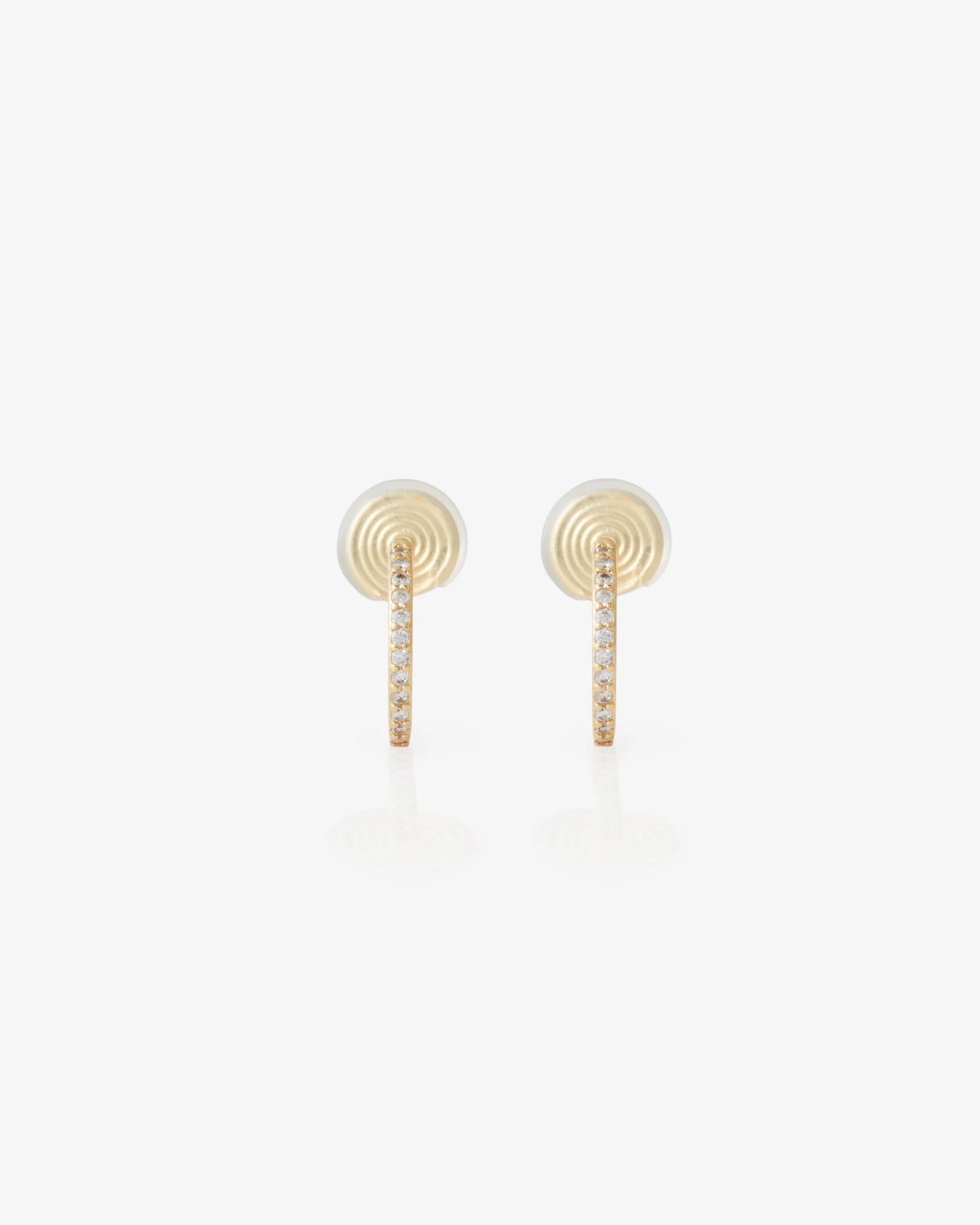 Pair of gold earrings on a white background
