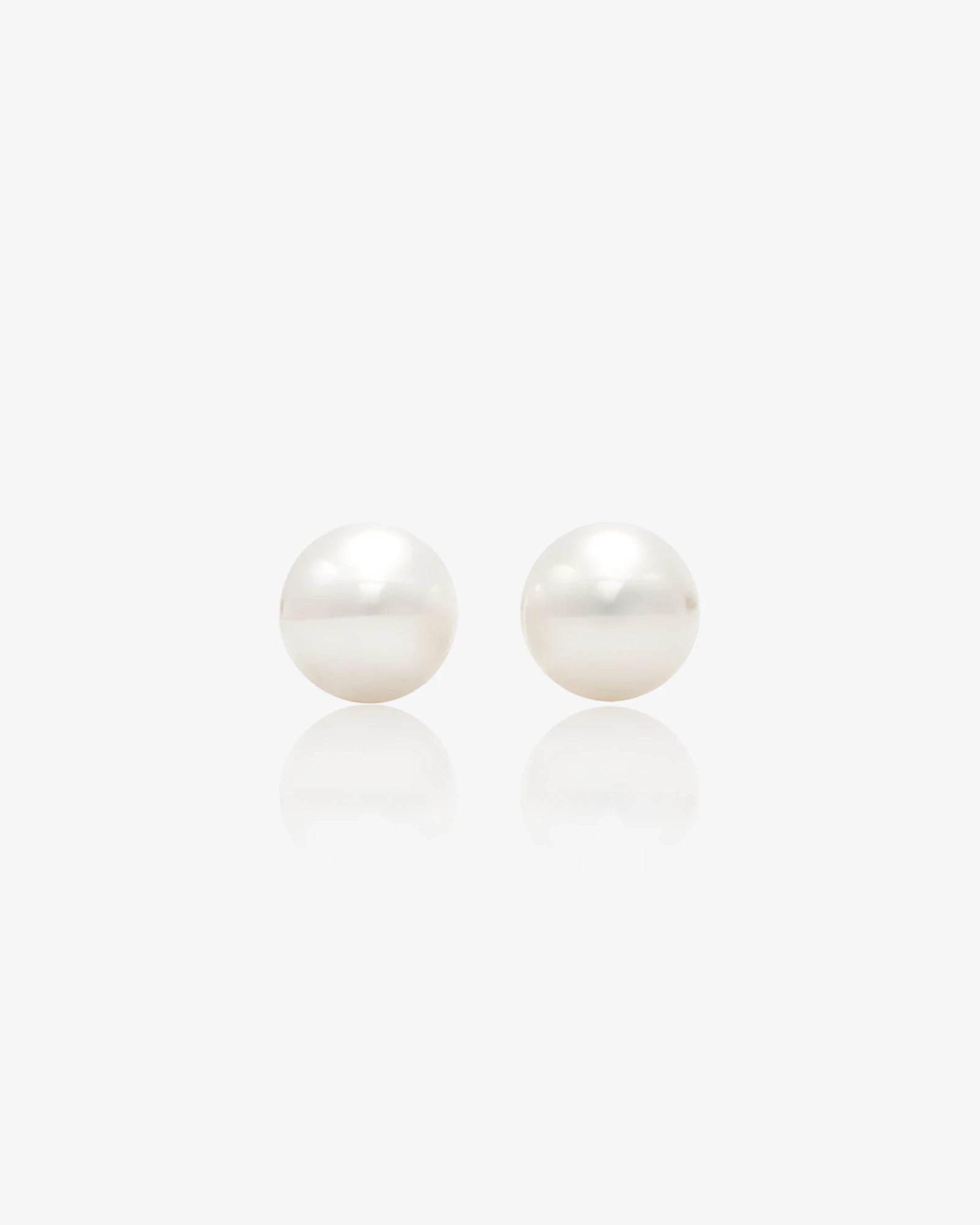 Pair of pearl earrings on a white background