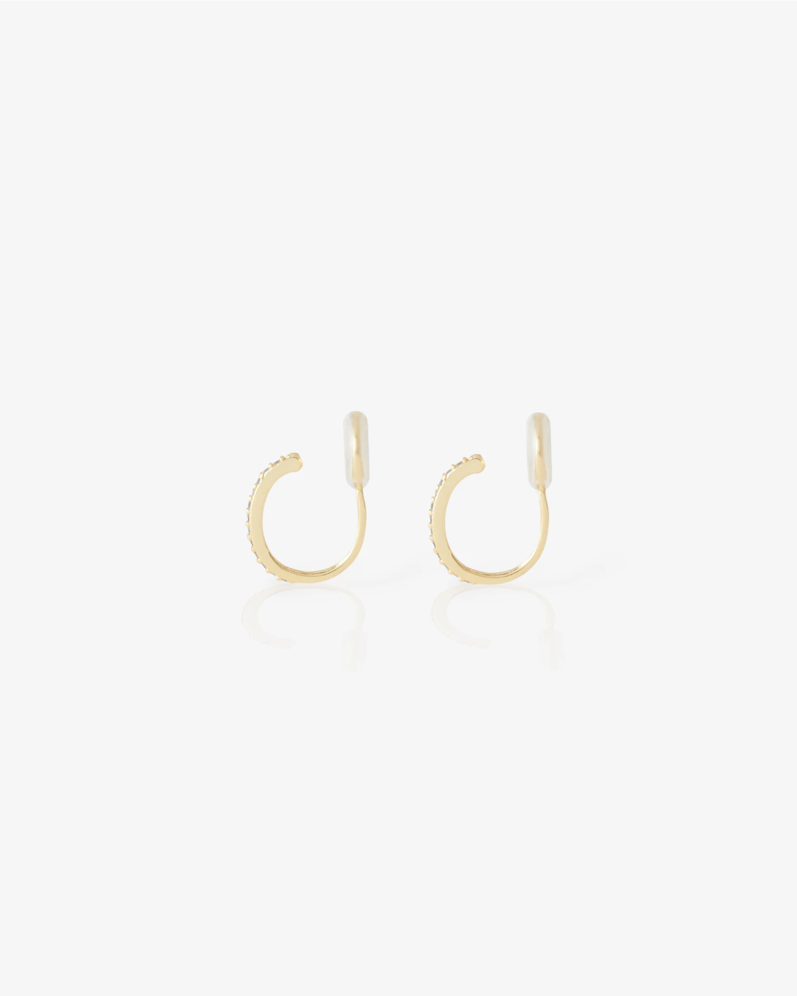 Gold hoop earrings on a white background