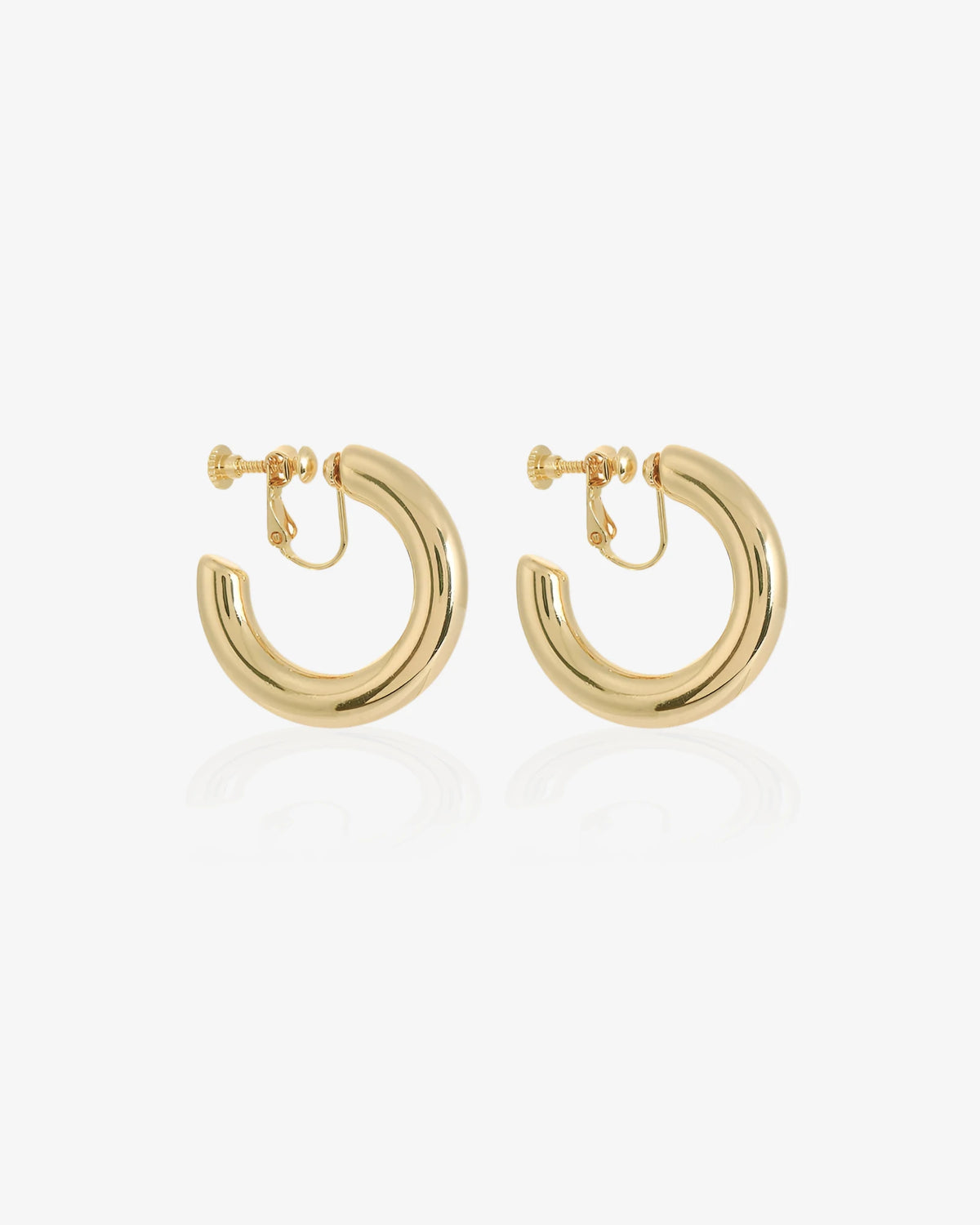Gold hoop earrings on a white background