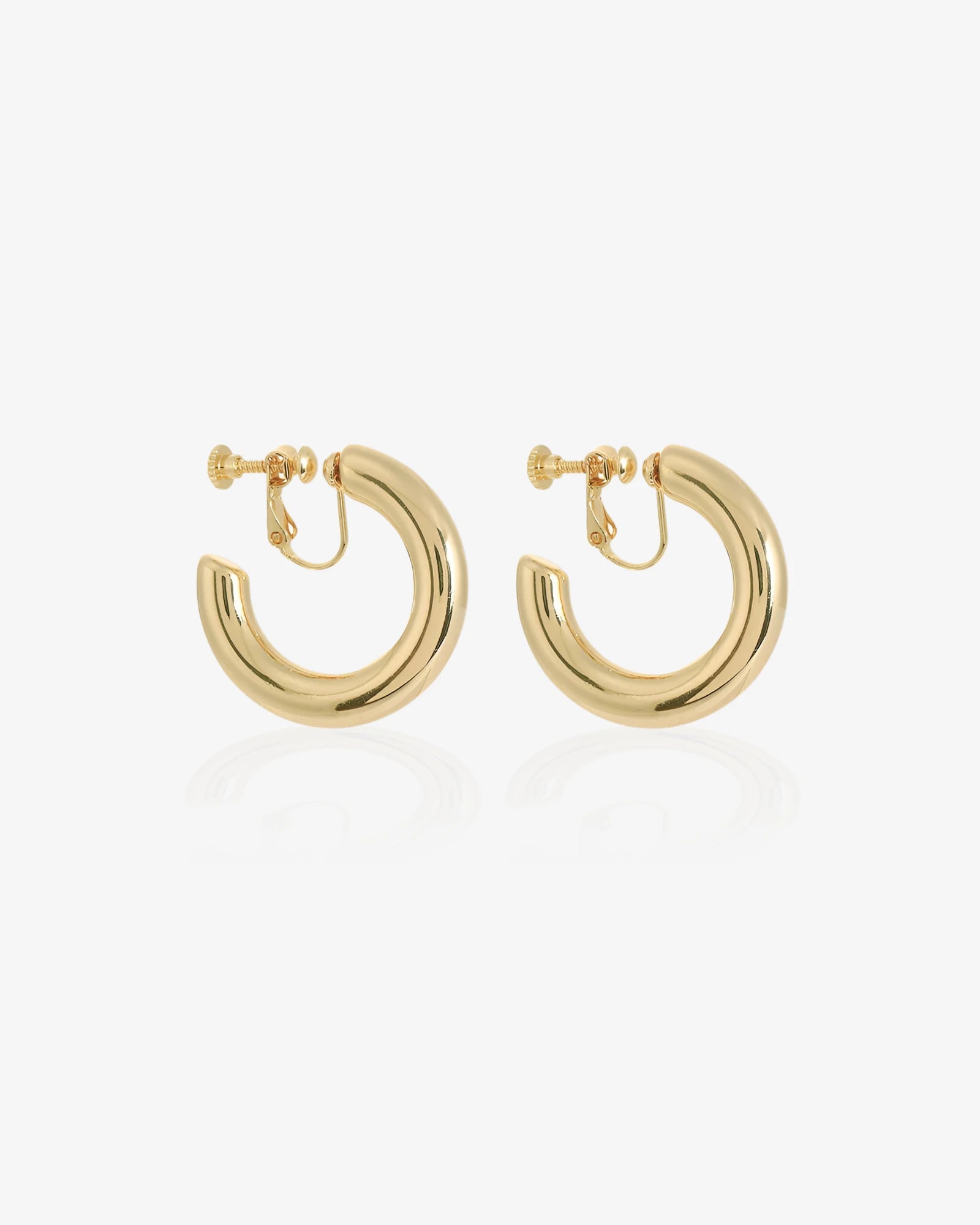 Gold hoop earrings on a white background