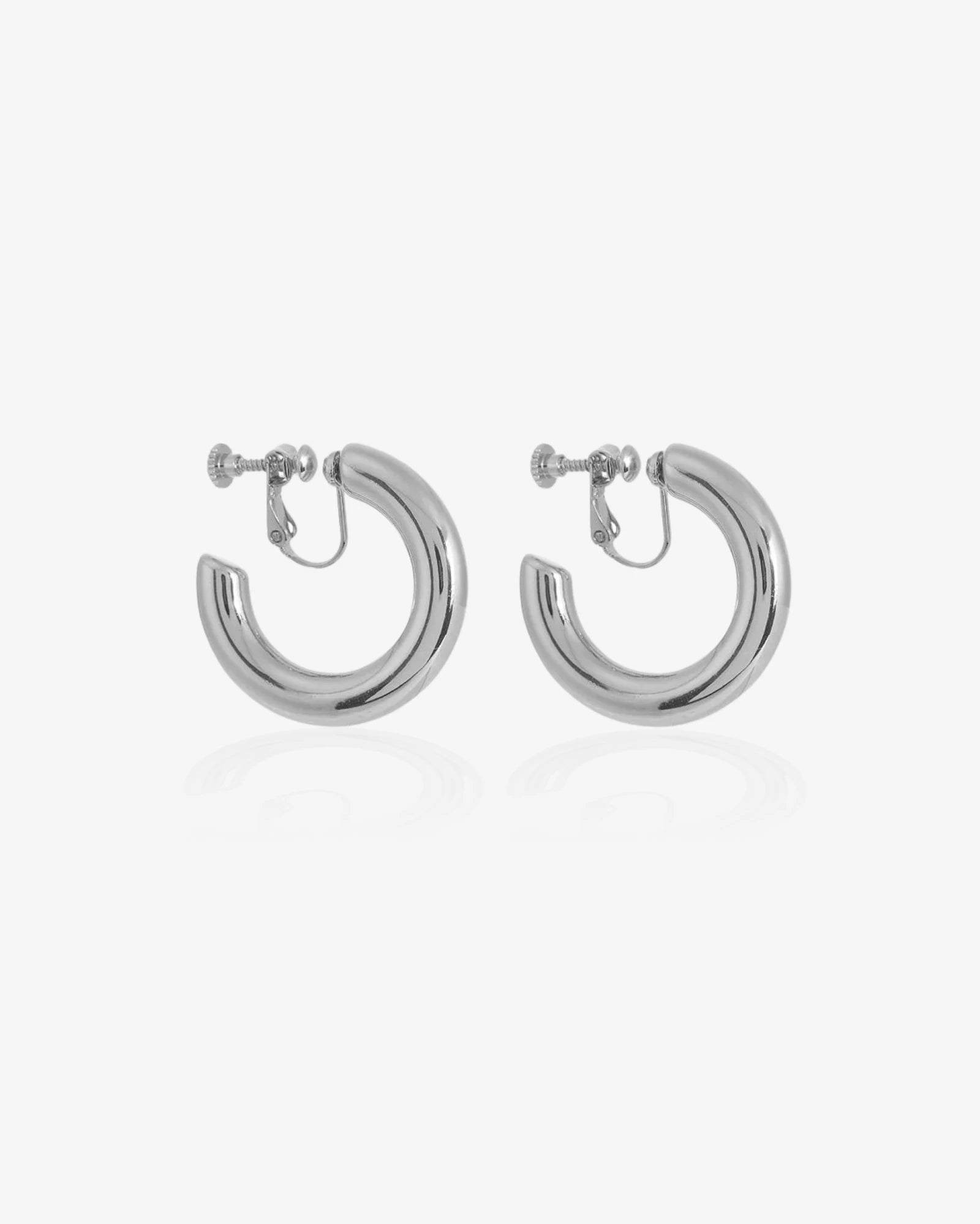Pair of silver hoop earrings on a white background