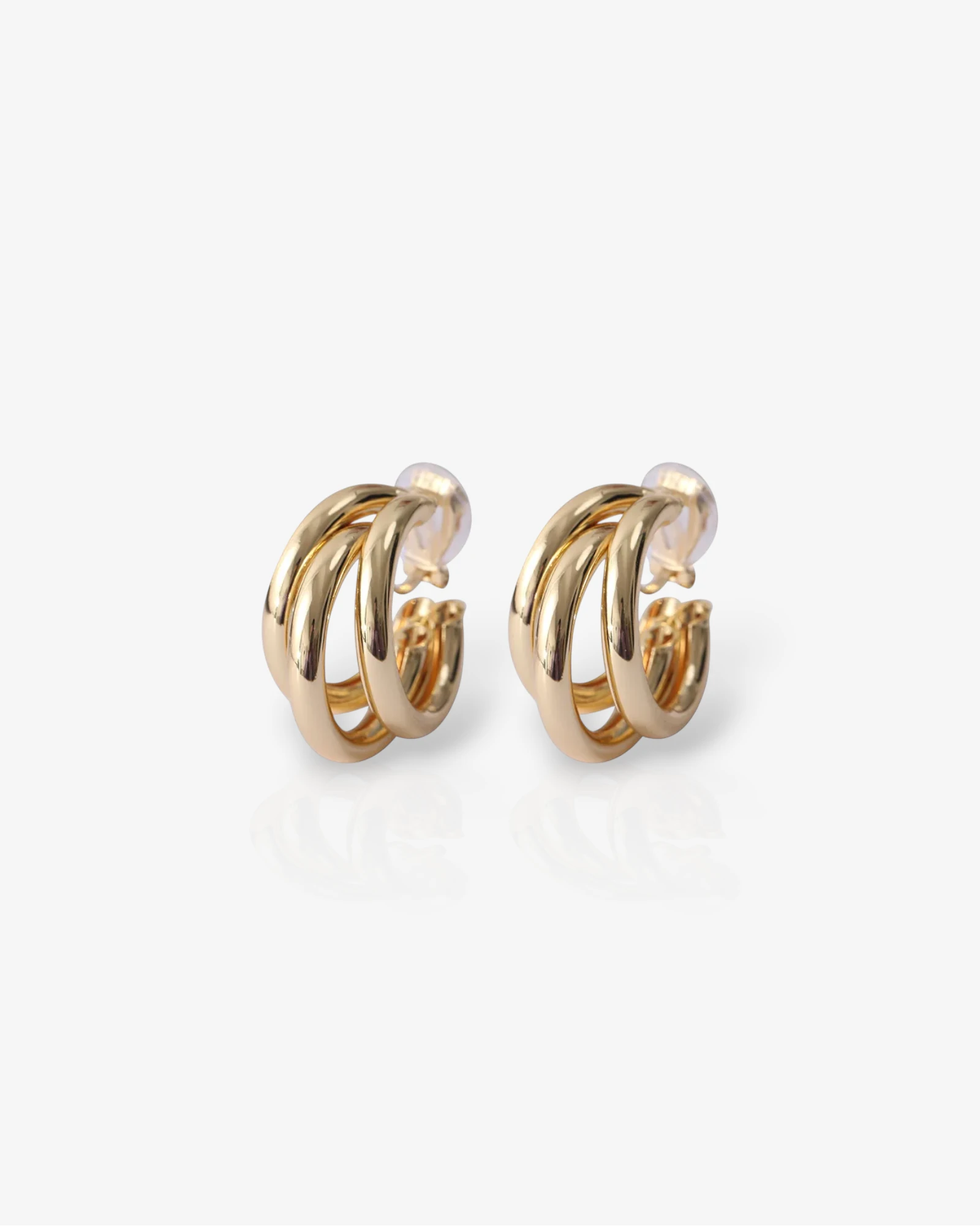 Pair of gold hoop earrings on a white background