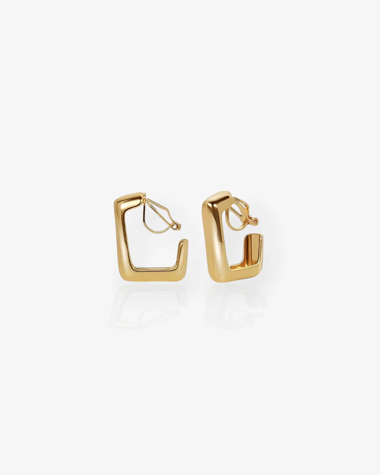 Gold hoop earrings on a white background
