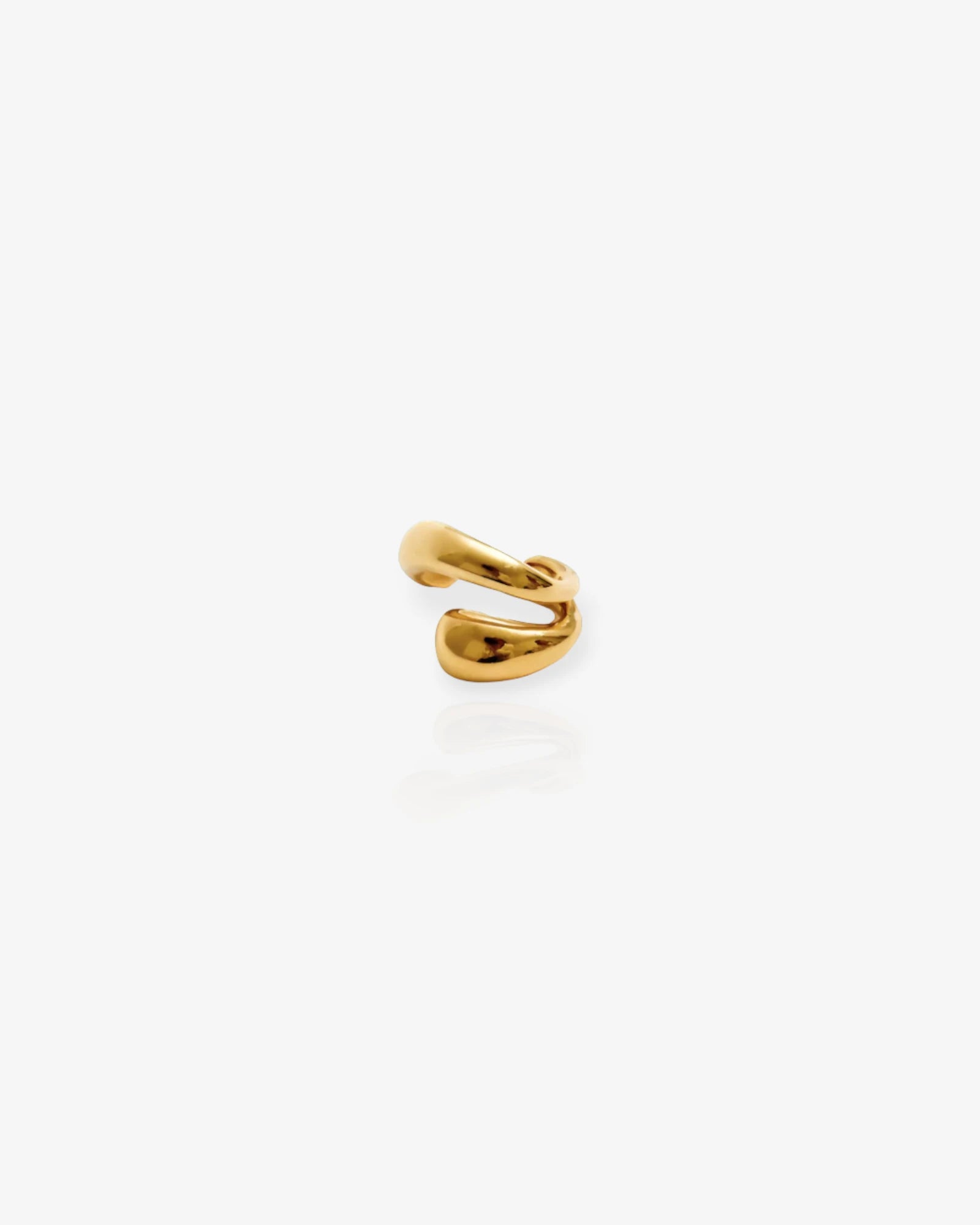 gold ear cuff on white background