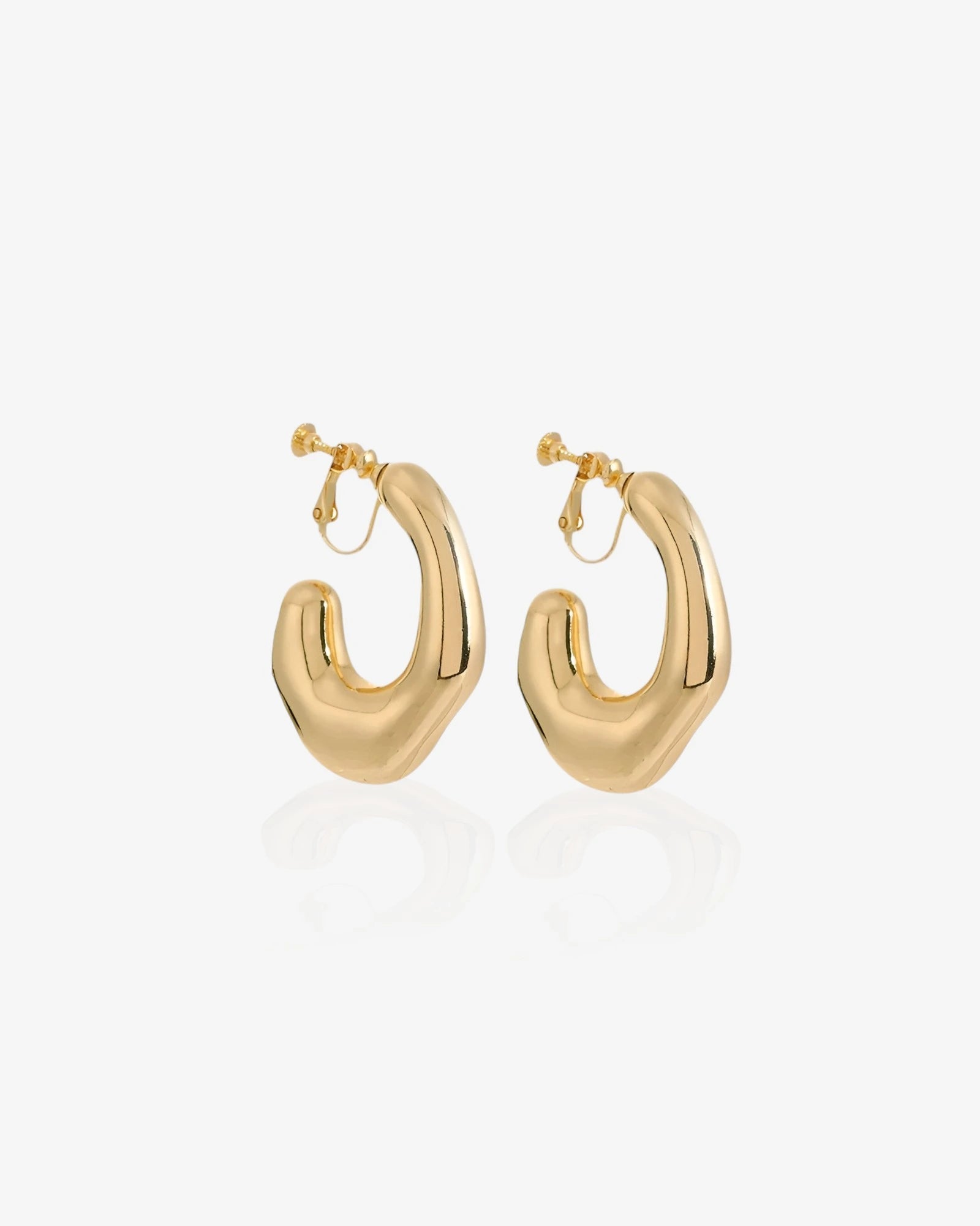 Gold hoop earrings on a white background