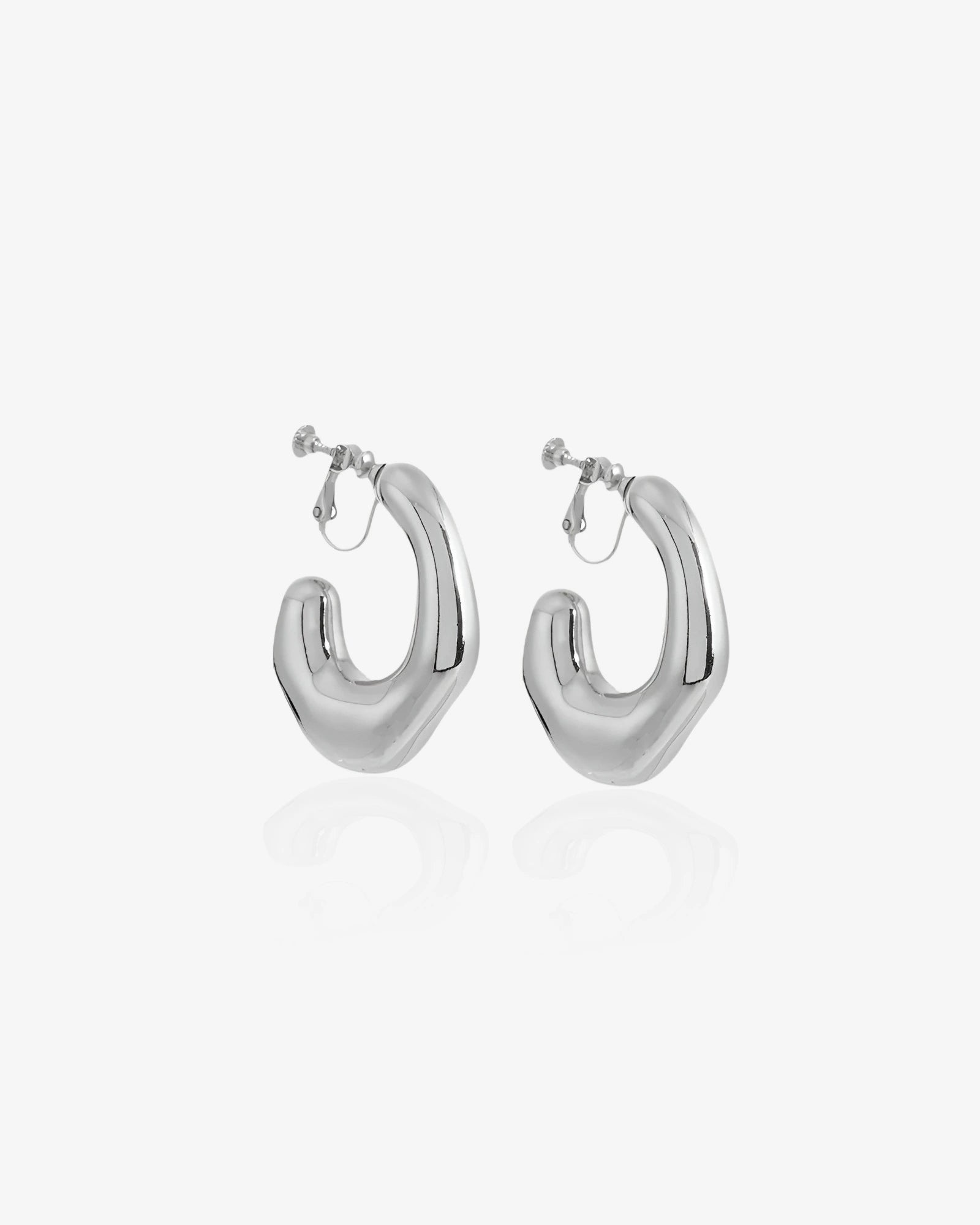 Pair of silver hoop earrings on a white background